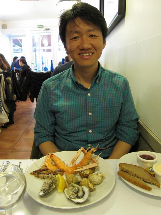 Zhizhong with a seafood appetizer in Trouville-sur-Mer.