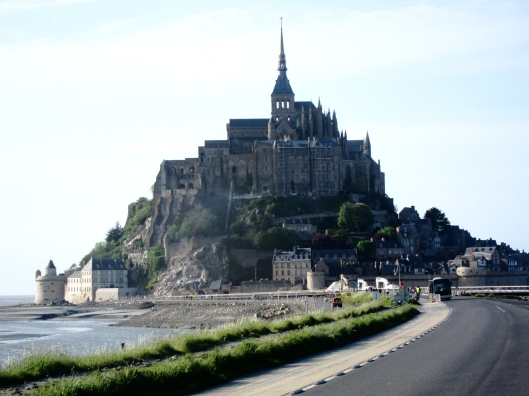 A shuttle bus carries people to Mont-St-Michel from the many parking areas over a causeway (soon to be replaced by a bridge). 