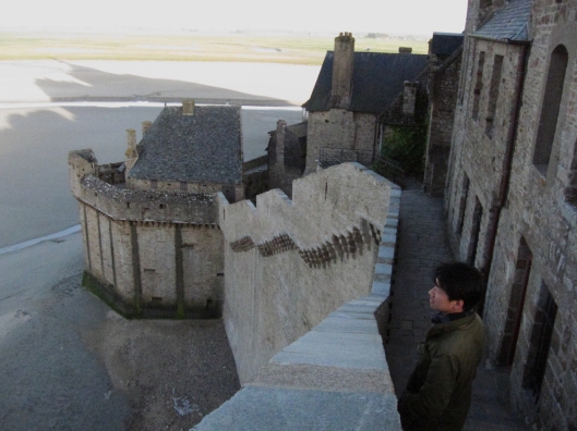 Zhizhong gazing out to sea from the ramparts of Mont-St-Michel.