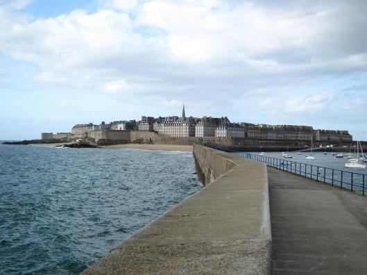 View of St-Malo from a long jetty. The old city was destroyed in World War II so all the buildings are postwar.