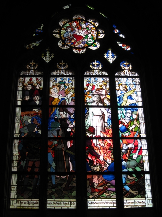 Joan of Arc getting rather dramatically burned at the stake in a late-19th century stained glass window of La cathédrale Sainte-Croix in (Old) Orléans.